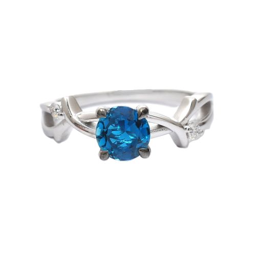 White gold ring with diamonds 0.06 ct and blue topaz 0.89 ct
