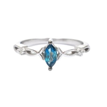 White gold ring with diamonds 0.06 ct and blue topaz 0.36 ct