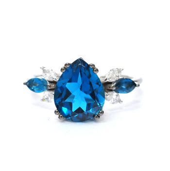 White gold ring with diamonds 0.22 ct and blue topaz 3.36 ct